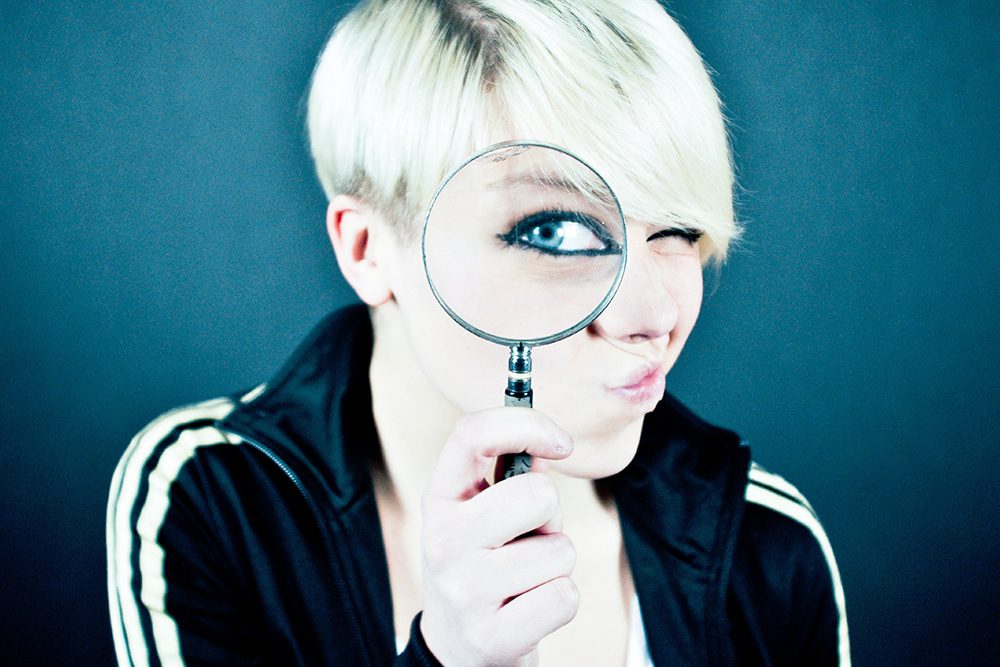 lady with magnifying glass